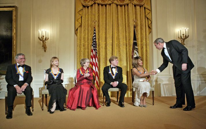 President George W. Bush congratulates Turner during a White House reception for Kennedy Center honorees in 2005. Other honorees, from left, are singer Tony Bennett, dancer Suzanne Farrell, actress Julie Harris and actor Robert Redford.