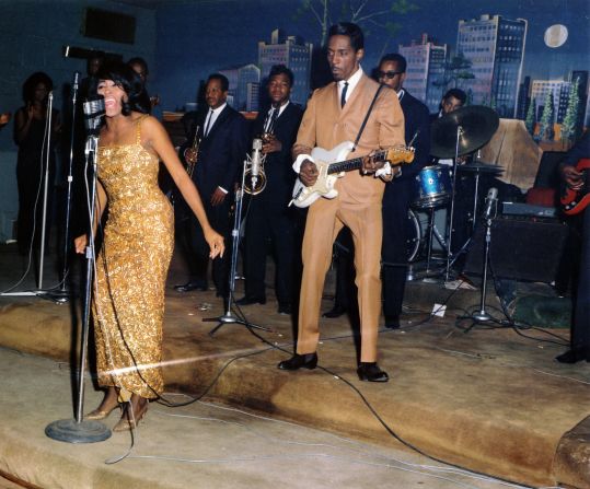 Turner performs with her husband, Ike Turner, in 1964. He recruited her at age 17 to join his band as a singer.
