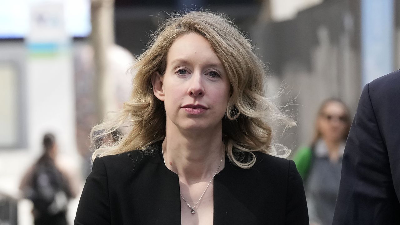 Former Theranos CEO Elizabeth Holmes leaves federal court in San Jose, Calif., March 17, 2023. Holmes has asked a federal judge, Wednesday, May 17, 2023, to allow her to remain free through the Memorial Day weekend before surrendering to authorities on May 30, to begin her more than 11-year prison sentence for defrauding investors in a blood-testing scam. 