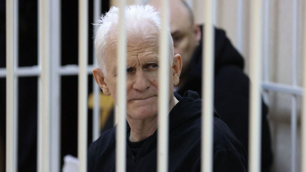Nobel Peace Prize winner Ales Bialiatski is seen in the defendants' cage in the courtroom at the start of a hearing in Minsk on January 5, 2023.