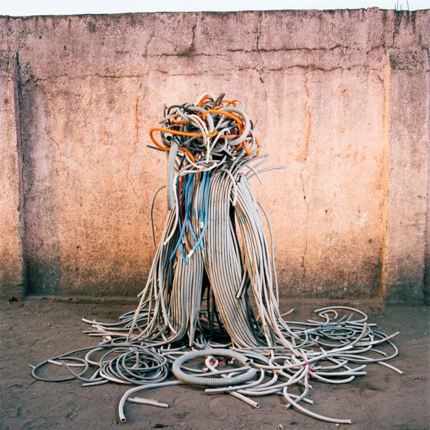 "I'm giving an echo to the work of the artists, what they have to say about their country and how it is managed," says Delfosse. In this photograph, taken in Selembao district, Kinshasa, Congolese artist Junior Lohaka Tshonga is dressed in an elaborate costume made from plastic pipes. Tshonga uses performance to condemn political inaction in a city of 13 million people.