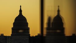 The US Capitol dome is seen from the base of the Washington Monument as the sun rises on November 9, 2022 in Washington, DC.