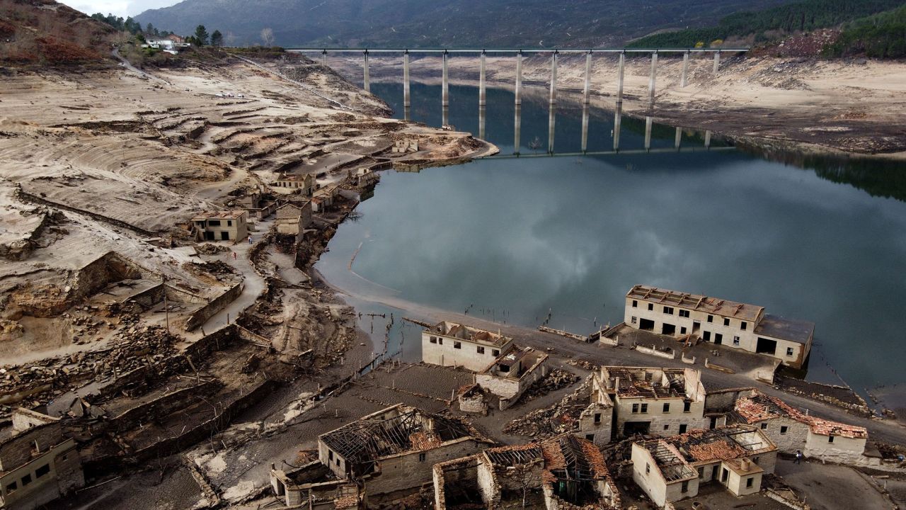 Usually submerged ruins of the former village of Aceredo, appearing from the Lindoso hydroelectric plant reservoir due to the low water level, near Lobios, northwestern Spain, on February 15, 2022. 