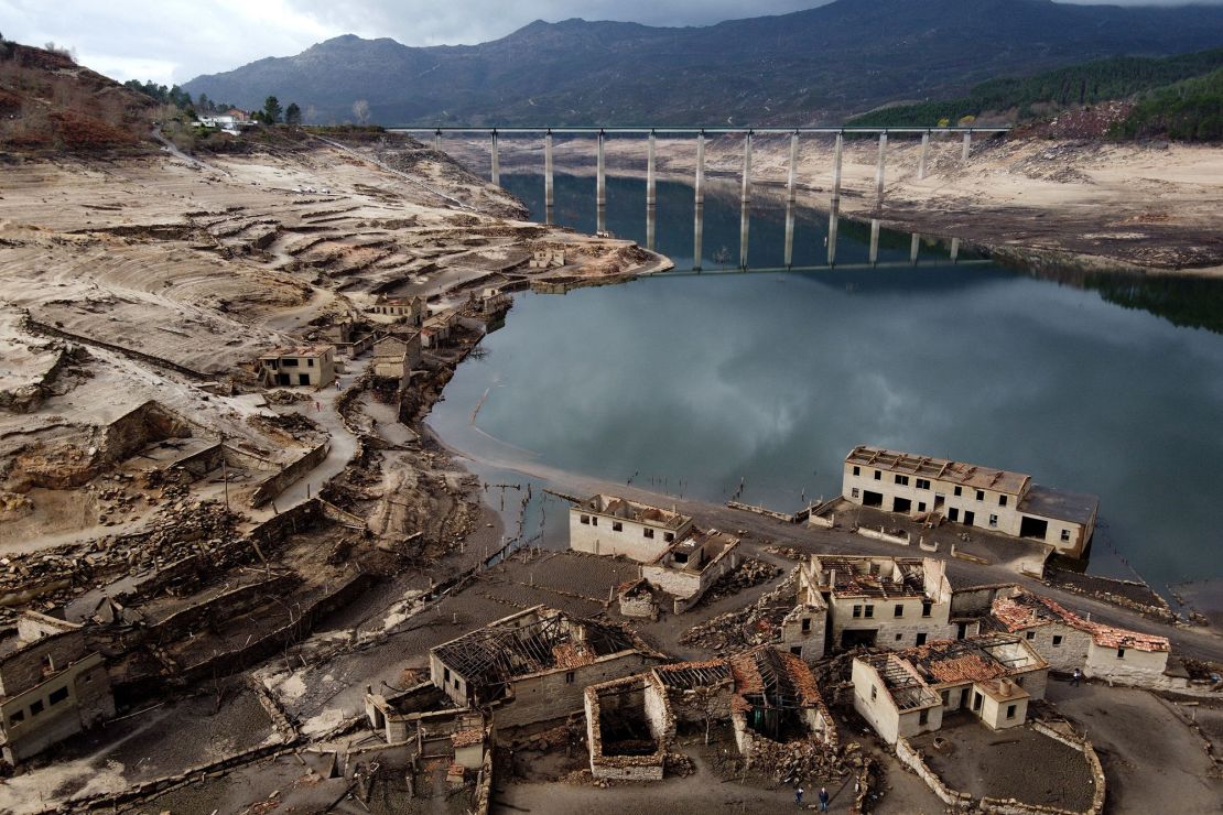Usually submerged ruins of the former village of Aceredo, appearing from the Lindoso hydroelectric plant reservoir due to the low water level, near Lobios, northwestern Spain, on February 15, 2022. 