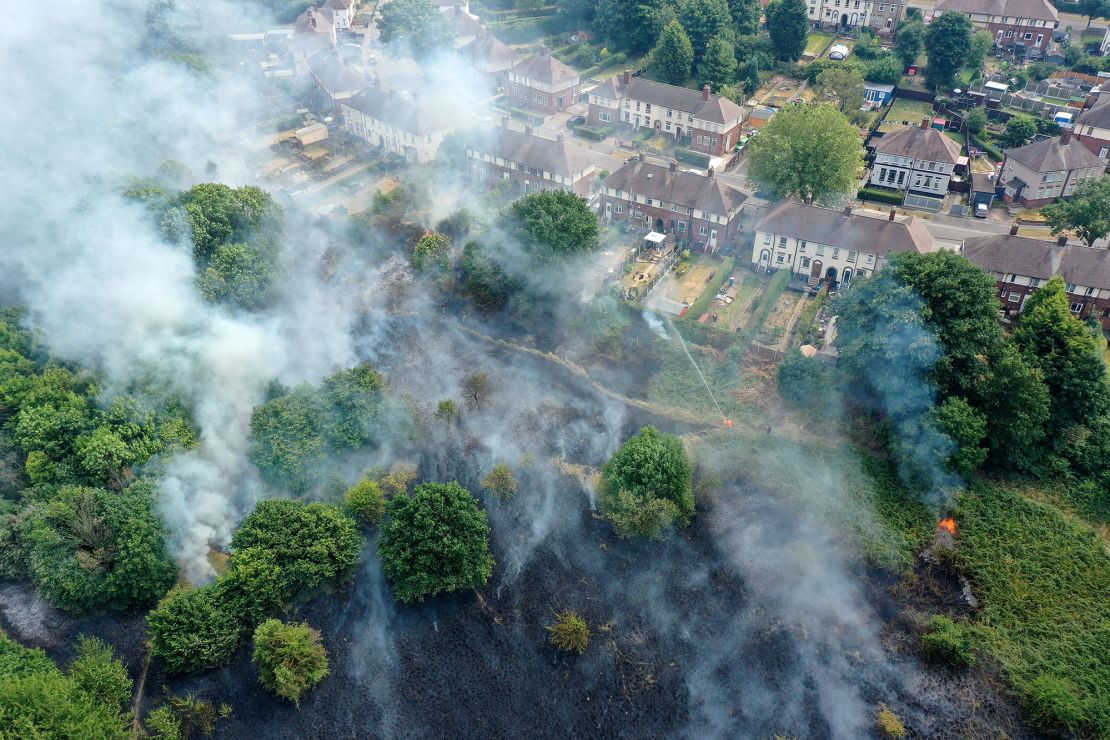 Firefighters contain a wildfire on July 20, 2022, in Sheffield, England. Multiple fires broke out across the UK during a record-breaking heatwave. 