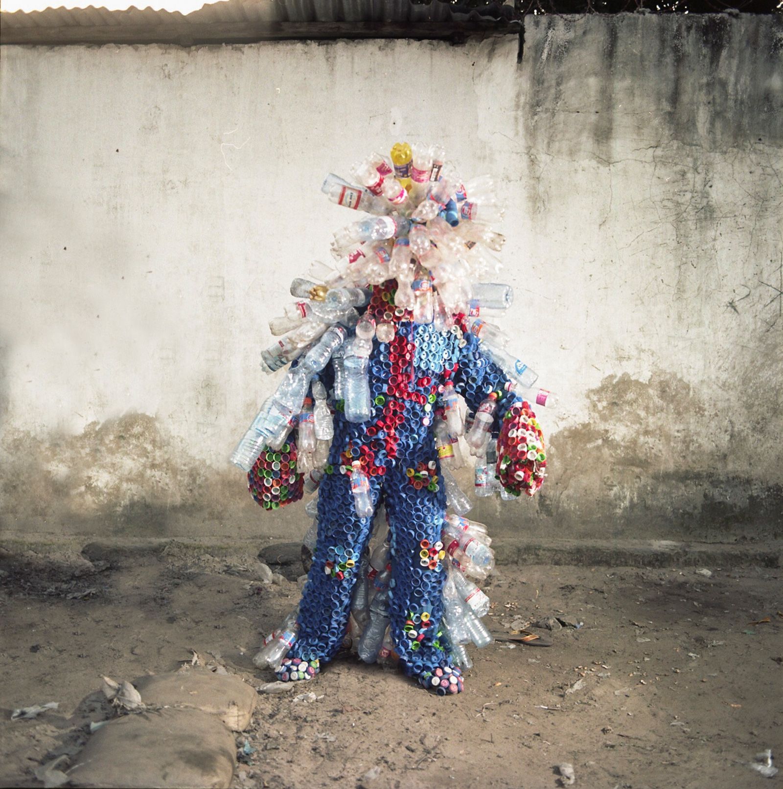 Congolese artists wear costumes made of trash to shine a light on  Kinshasa's pollution problem