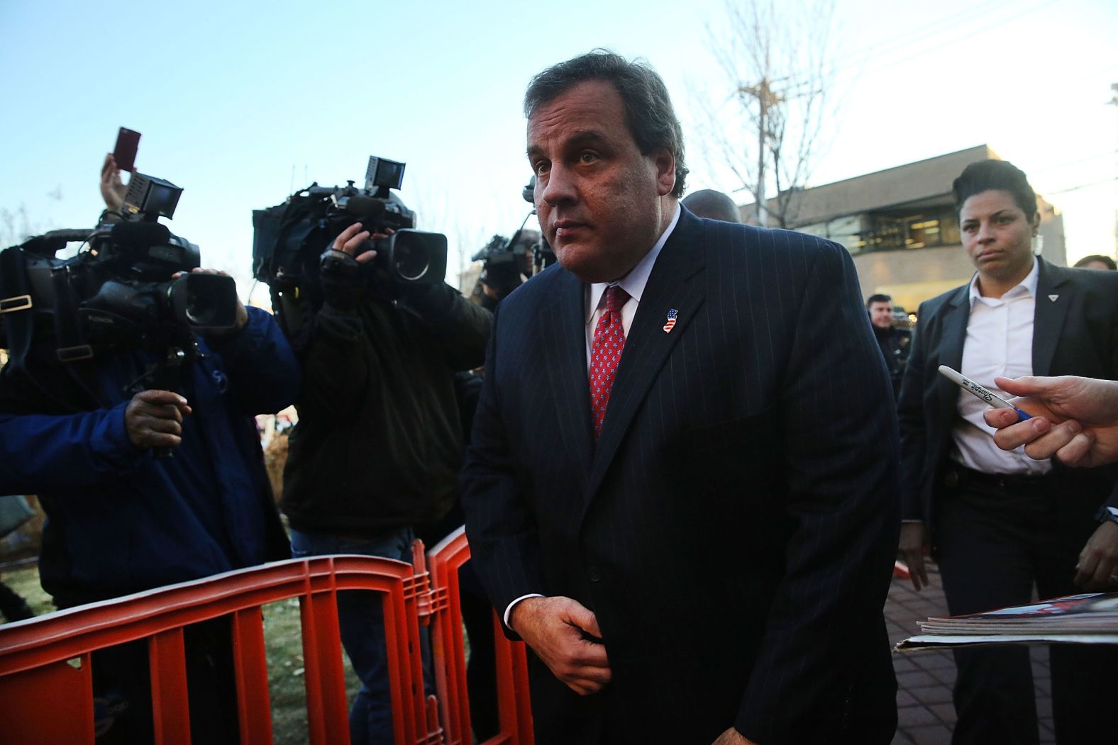Christie enters the borough hall in Fort Lee, New Jersey, to apologize to Mayor Mark Sokolich in January 2014. Lane closures had snarled traffic for days at the George Washington Bridge, which connects Manhattan to Fort Lee. It was alleged that Christie's deputy chief of staff signaled for the New York and New Jersey Port Authority to close the lanes to punish Sokolich for not endorsing Christie during the election. Christie said he had no knowledge of any plot to close the lanes. He was never charged in the "Bridgegate" scandal, but two former officials linked to his office, including the deputy chief of staff, <a href="index.php?page=&url=http%3A%2F%2Fwww.cnn.com%2F2017%2F03%2F29%2Fus%2Fbridgegate-sentencing%2F" target="_blank">were convicted</a> in 2017 of using their power to close the lanes as an act of political revenge. In 2020, the US Supreme Court <a href="index.php?page=&url=https%3A%2F%2Fwww.cnn.com%2F2020%2F05%2F07%2Fpolitics%2Fsupreme-court-bridgegate-new-jersey-opinion%2Findex.html" target="_blank">threw out the fraud convictions</a>.