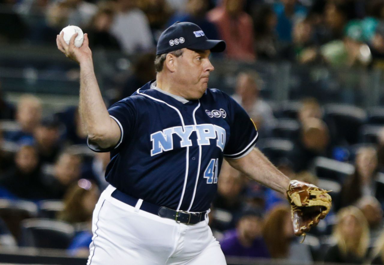 Christie throws to first base during the "True Blue" celebrity softball game held at New York's Yankee Stadium in 2015. The charity event raised money to support the families of fallen New York police officers.