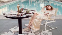 American actress Faye Dunaway takes breakfast by the pool with the day's newspapers at the Beverley Hills Hotel, 29th March 1977. She seems less than elated with her success at the previous night's Academy Awards ceremony, where she won the 1976 Oscar for Best Actress in a Leading Role for 'Network'.