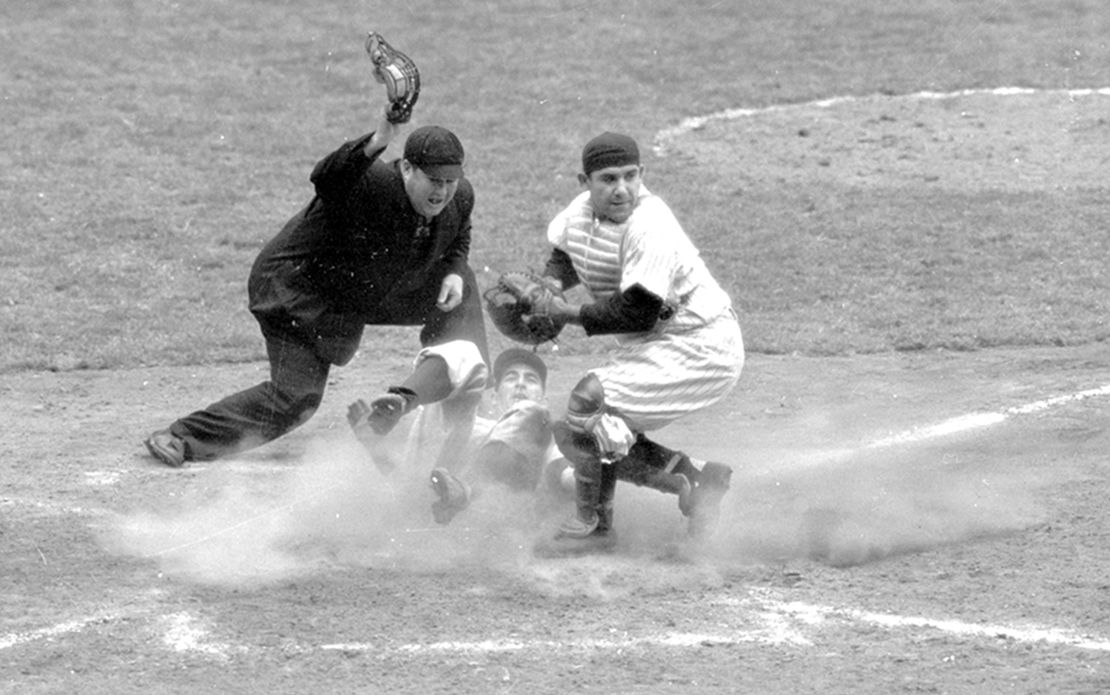 In this Oct. 6, 1950, file photo, Philadelphia Phillies shortstop Granny Hamner is tagged at the plate by New York Yankees catcher Yogi Berra as he tries to score from third in the ninth inning of Game 3 of the World Series, at Yankee Stadium in New York. The Yankees won 3-2.