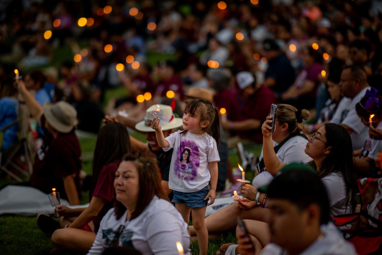 Families in Uvalde, Texas, participate in a candlelight vigil on Wednesday, May 24, to remember the <a href="https://www.cnn.com/interactive/2023/05/us/victims-uvalde-school-shooting/" target="_blank">19 children and two adults</a> who were killed during a mass shooting last year at Robb Elementary School.