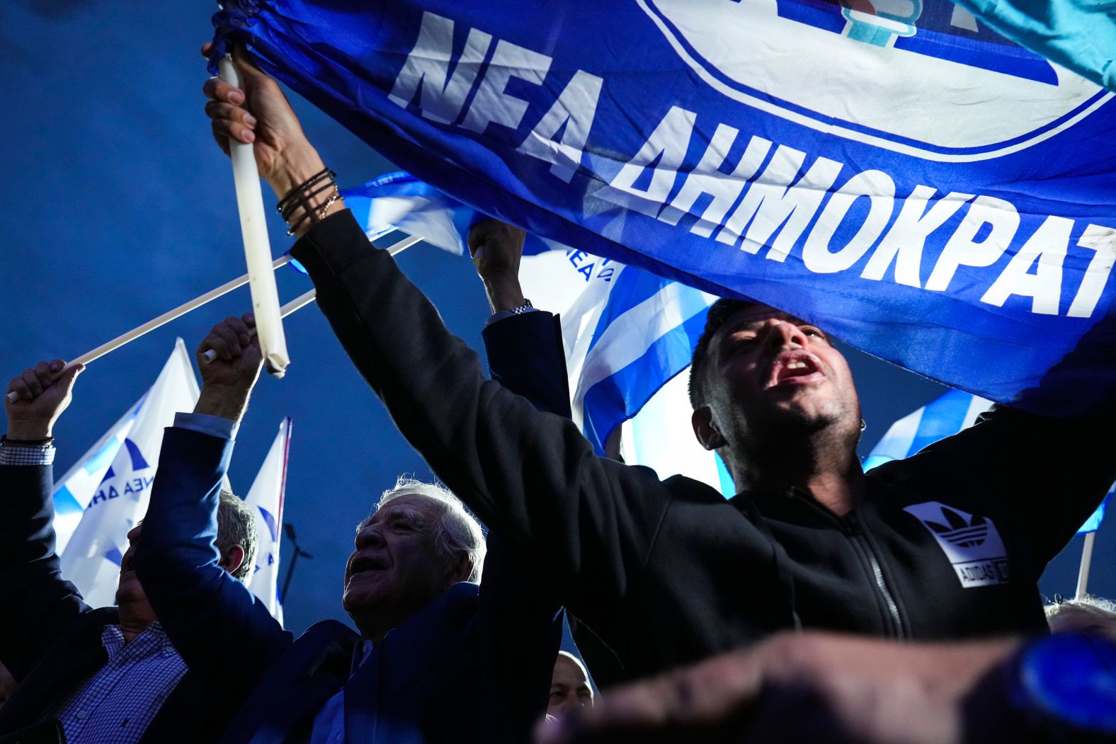Supporters of Greek Prime Minister Kyriakos Mitsotakis shout slogans outside his party's headquarters in Athens on Sunday, May 21. The ruling New Democracy party <a href="index.php?page=&url=https%3A%2F%2Fwww.cnn.com%2F2023%2F05%2F22%2Feurope%2Fgreece-general-election-no-majority-intl%2Findex.html" target="_blank">scored a crushing victory in parliamentary elections Sunday</a> but fell short of winning an outright majority in a vote dominated by the cost-of-living crisis, a wiretapping scandal and anger over the country's deadliest train crash.