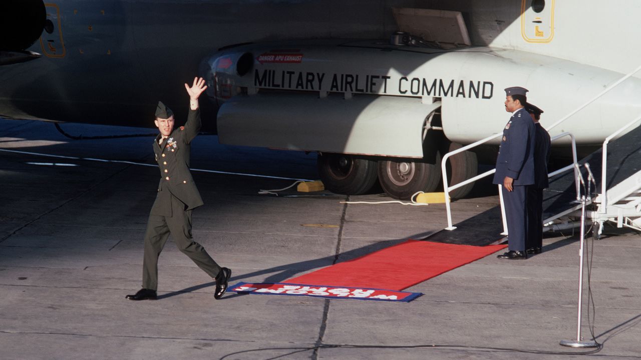 Former POW Ken Wallingford waves to well wishers upon his arrival at Clark Air Base, Philippines, after his release in February 1973.