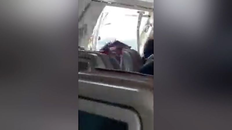 Video: Passenger opens plane’s emergency door midair  | CNN