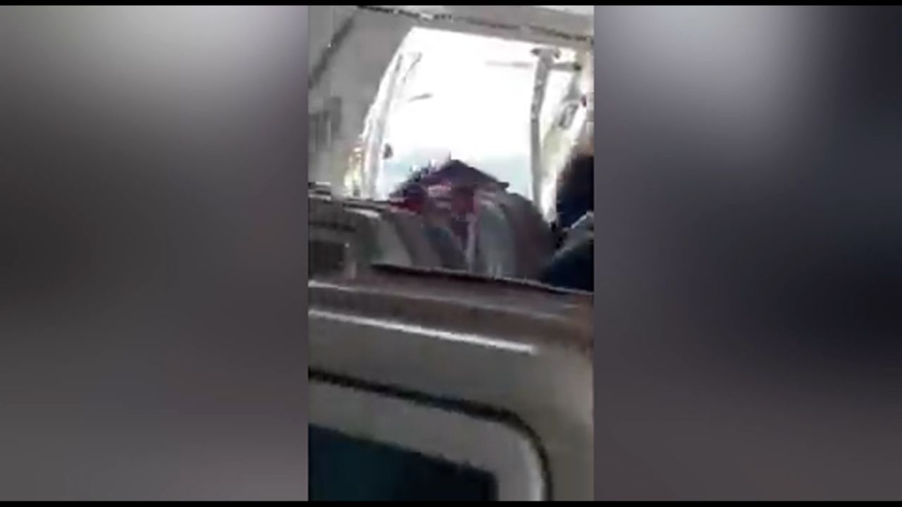 Footage taken from inside the Asiana Airlines plane shows the terrifying moment the door opened midair.