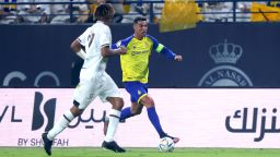 Shabab's Saudi defender Fawaz al-Sqoor (L) marks Nassr's Portuguese forward Cristiano Ronaldo during the Saudi Pro League football match between Al-Nassr and Al-Shabab at the al-Awwal Park Stadium in Riyadh on May 23, 2023.