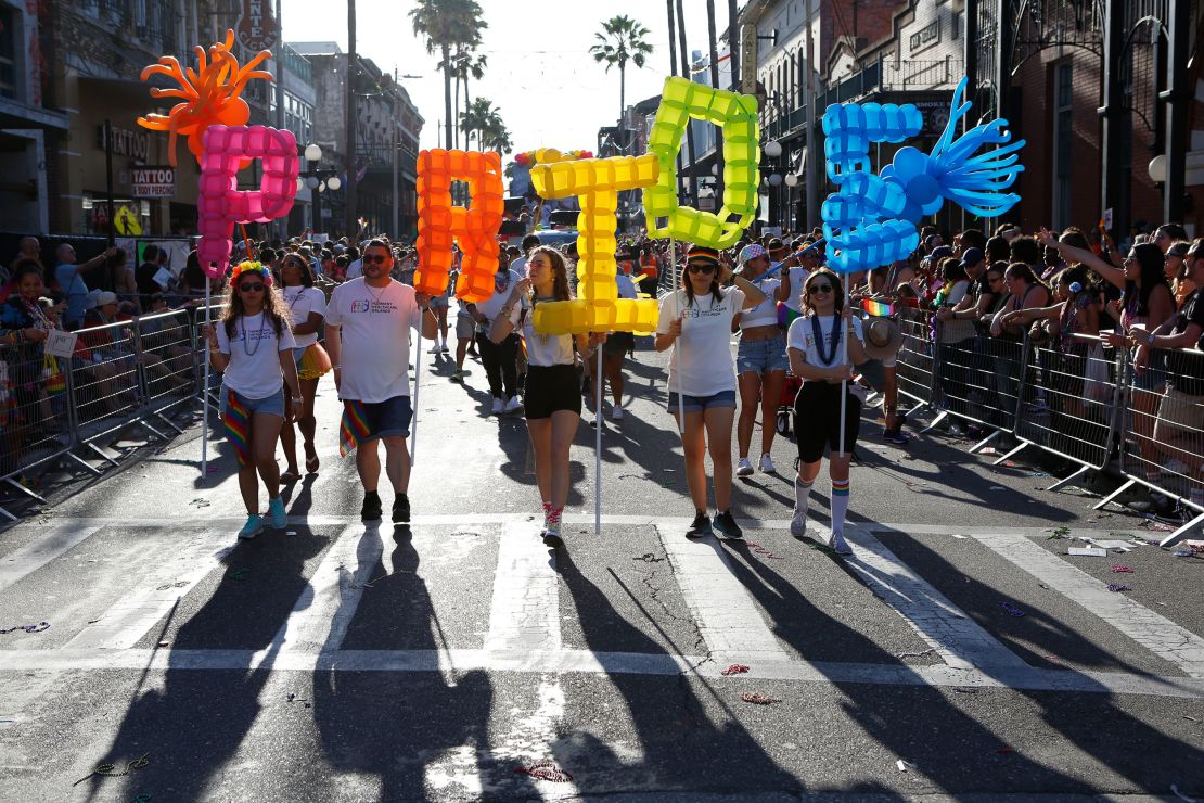 TAMPA, FL - MARCH 26: Revelers celebrate on 7th Avenue during the Tampa Pride Parade in the Ybor City neighborhood on March 26, 2022 in Tampa, Florida. The Tampa Pride was held in the wake of the passage of Florida's controversial "Don't Say Gay" Bill.