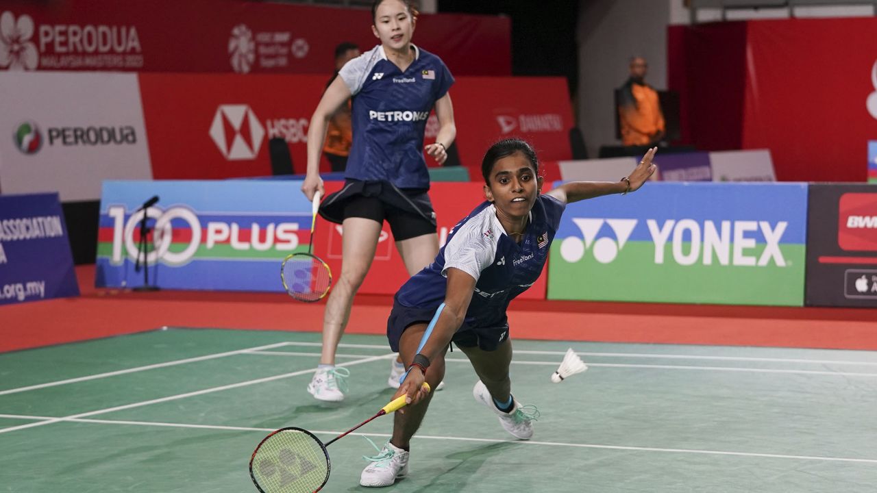 Malaysia's Thinaah Muralitharan (front), with Pearly Tan, tries to receive a shot during their women's doubles badminton match against Japan's Rena Miyaura and Ayako Sakuramoto at the Malaysia Masters on May 25.