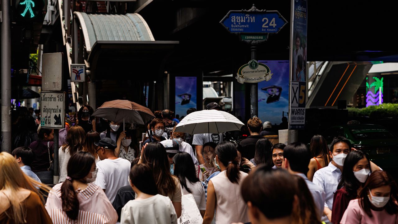 Pedestrians use umbrellas to shield themselves from the sun in Bangkok, Thailand, on April 25.