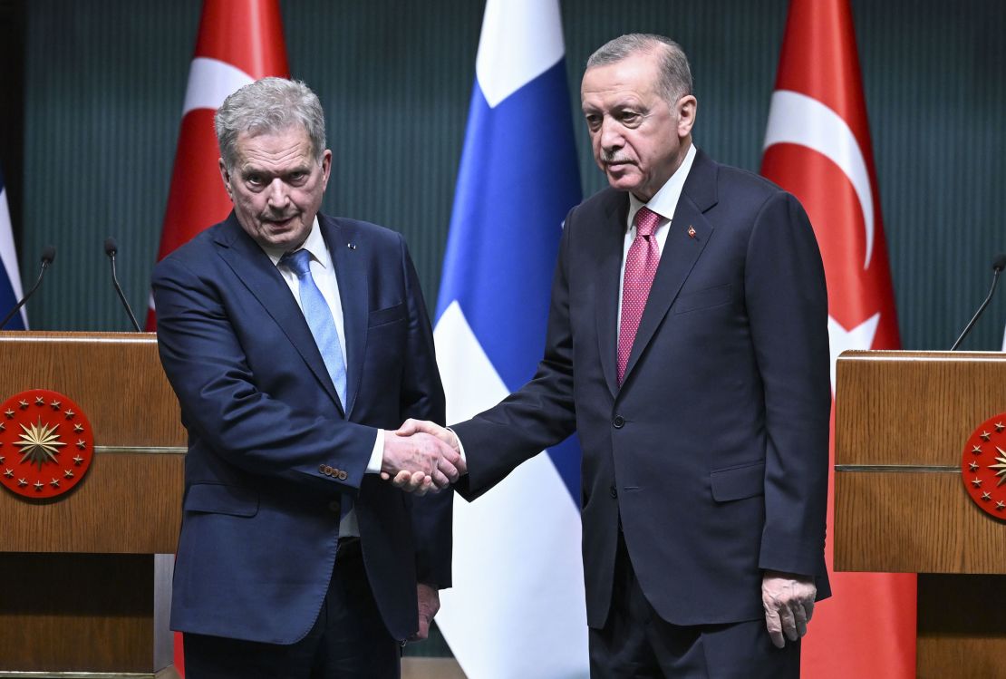 Turkish President Recep Tayyip Erdogan (R) and Finnish President Sauli Niinisto (L) shake hands following a joint press conference held after their meeting at the Presidential Complex in Ankara, Turkey on March 17.