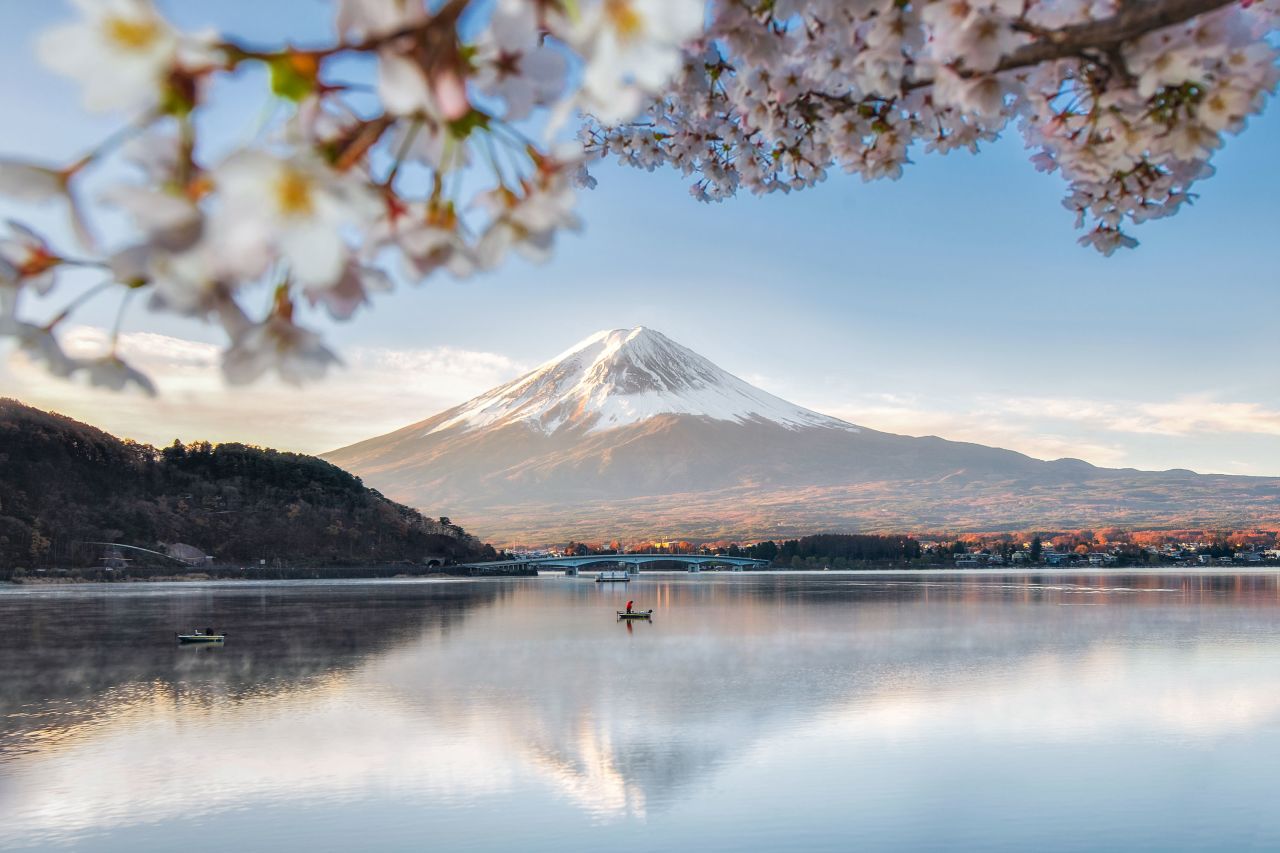 Fuji Mountain Reflection with Sakura Branches at Kawaguchiko Lake in Spring