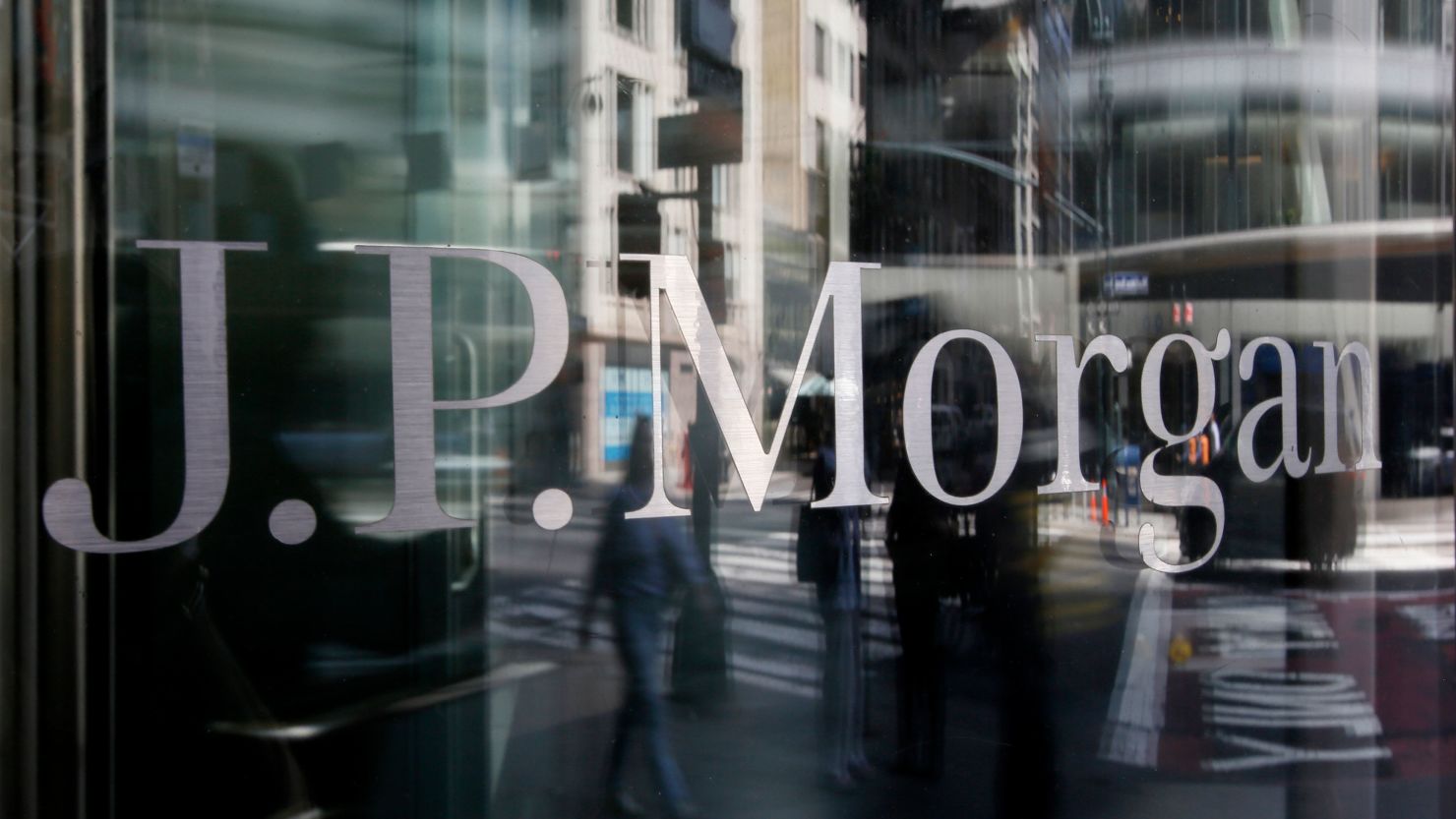 People are reflected into a J.P.Morgan Chase & Co window on April 14, 2023 in New York City.