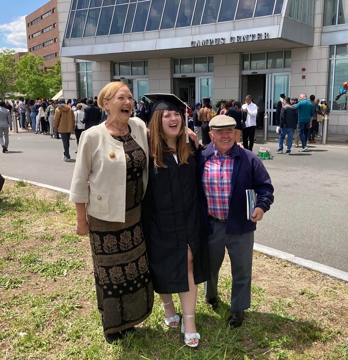 UMass Boston graduate Addie McElreath poses with her grandparents at her graduation ceremony on May 25, 2023.