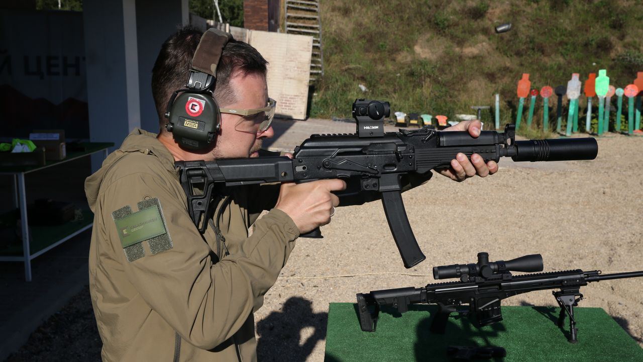 A man shoots an AK-12 Kalashnikov assault rifle ahead of an arms show in Russia in 2020.