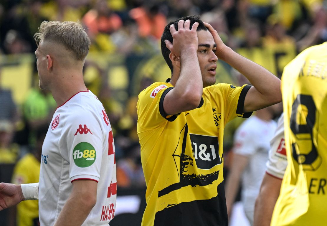 Dortmund's US midfielder Gio Reyna reacts during the match.