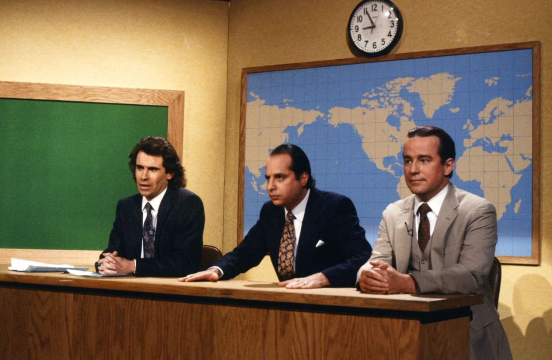 (From left) Dennis Miller, Jon Lovitz and Phil Hartman during the 'Weekend Update' segment on "Saturday Night Live" in December 1986.