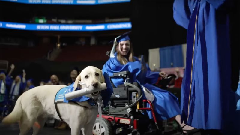 Justin, the service dog for Grace Mariani, was presented with a diploma.