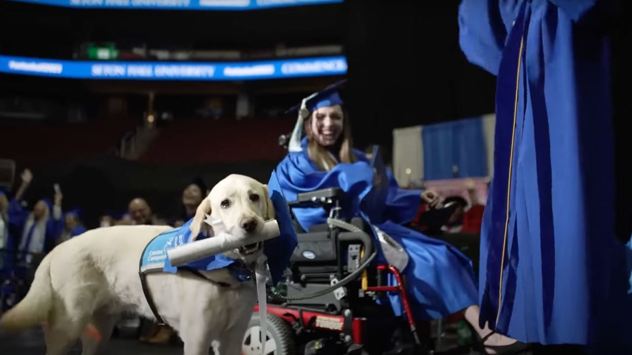 Justin, the service dog for Grace Mariani, was presented with a diploma.