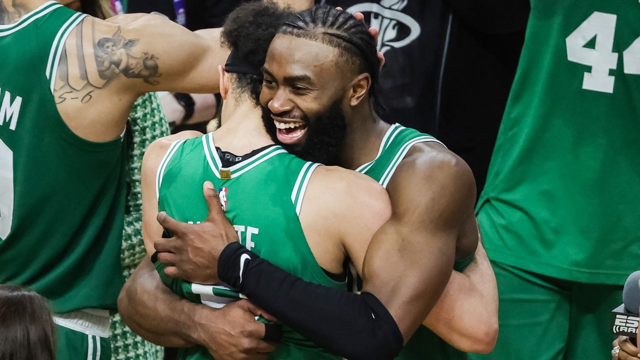Derrick White #9 and Jaylen Brown #7 of the Boston Celtics react after defeating the Miami Heat 104-103 in game six of the Eastern Conference Finals at Kaseya Center on May 27, 2023 in Miami, Florida.