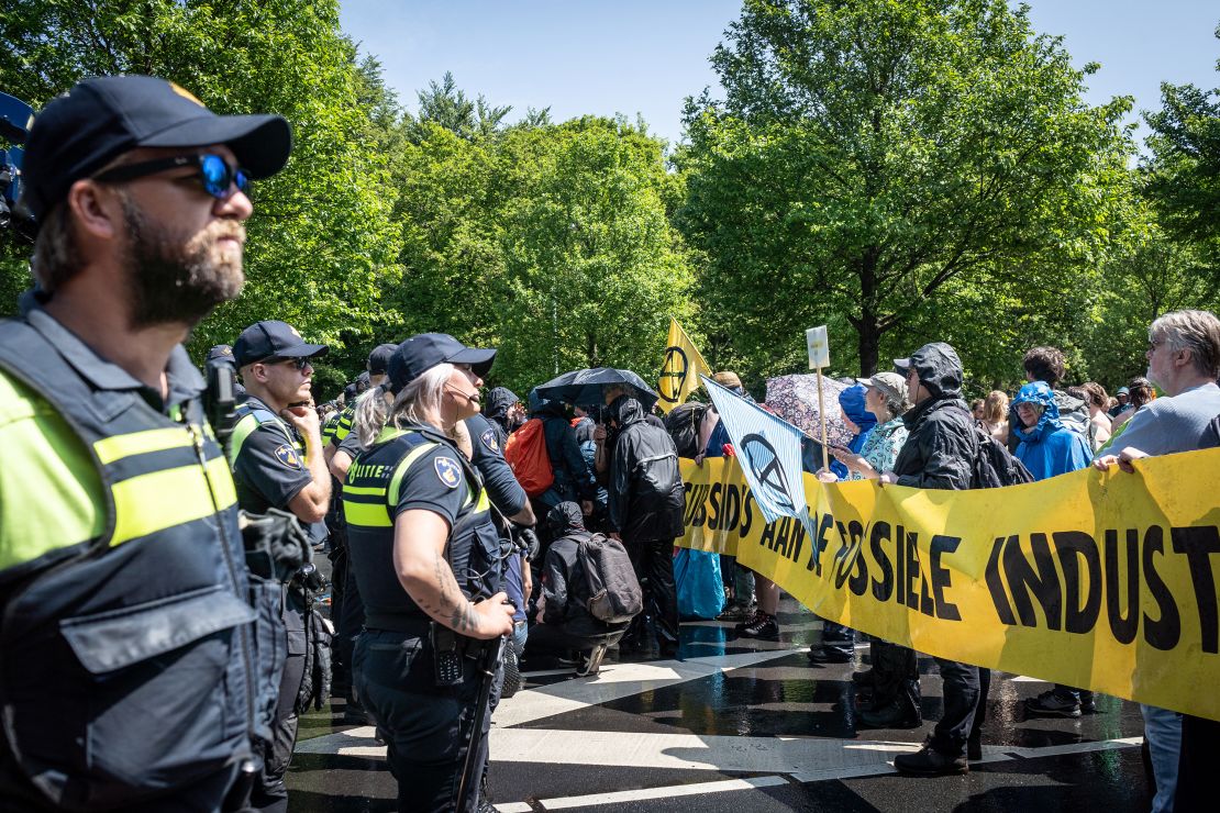 Activists on the highway in front of a police line, in Den Haag, Netherlands, on May 27, 2023.  