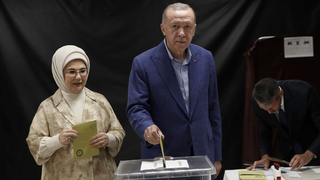 Turkish President Recep Tayyip Erdogan, right, and his wife Emine Erdogan, cast their ballots in Istanbul.