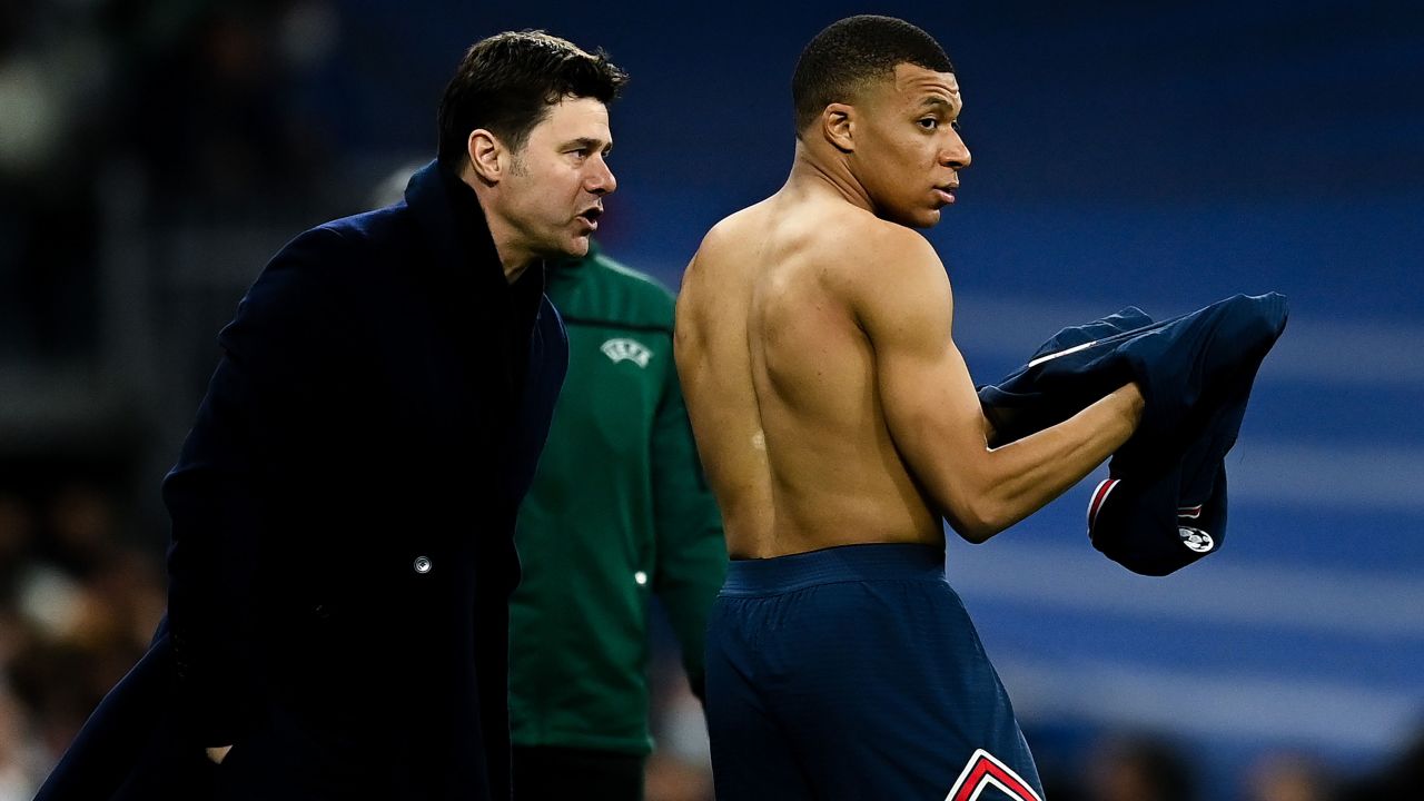Pochettino gives instructions to PSG forward Kylian Mbappé during last season's Champions League game against Real Madrid. 