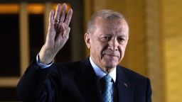 President Recep Tayyip Erdogan gestures to supporters at the presidential palace after winning the presidential runoff in Ankara, Turkey on Monday. 