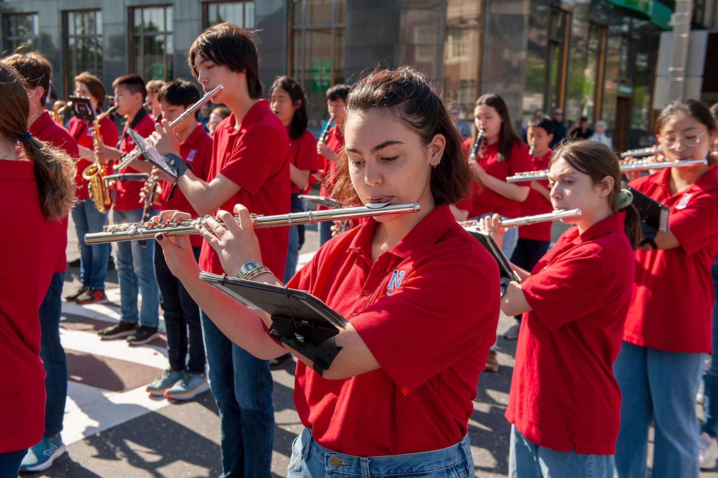 The Natick High School Marching Band plays the National Anthem during Memorial Day ceremonies in Natick, Massachusetts.