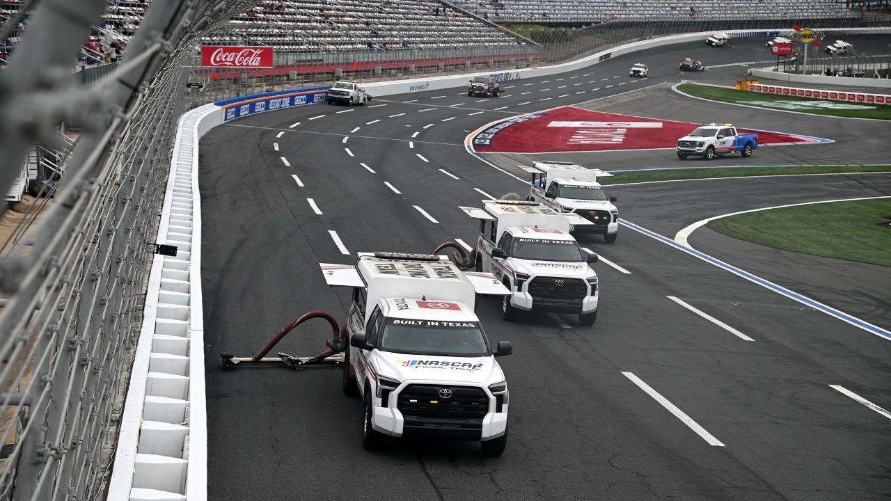 CONCORD, NORTH CAROLINA - MAY 29: The Toyota Track Drying Team works to dry the track prior to the NASCAR Xfinity Series Alsco Uniforms 300 at Charlotte Motor Speedway on May 29, 2023 in Concord, North Carolina. (Photo by Logan Riely/Getty Images)