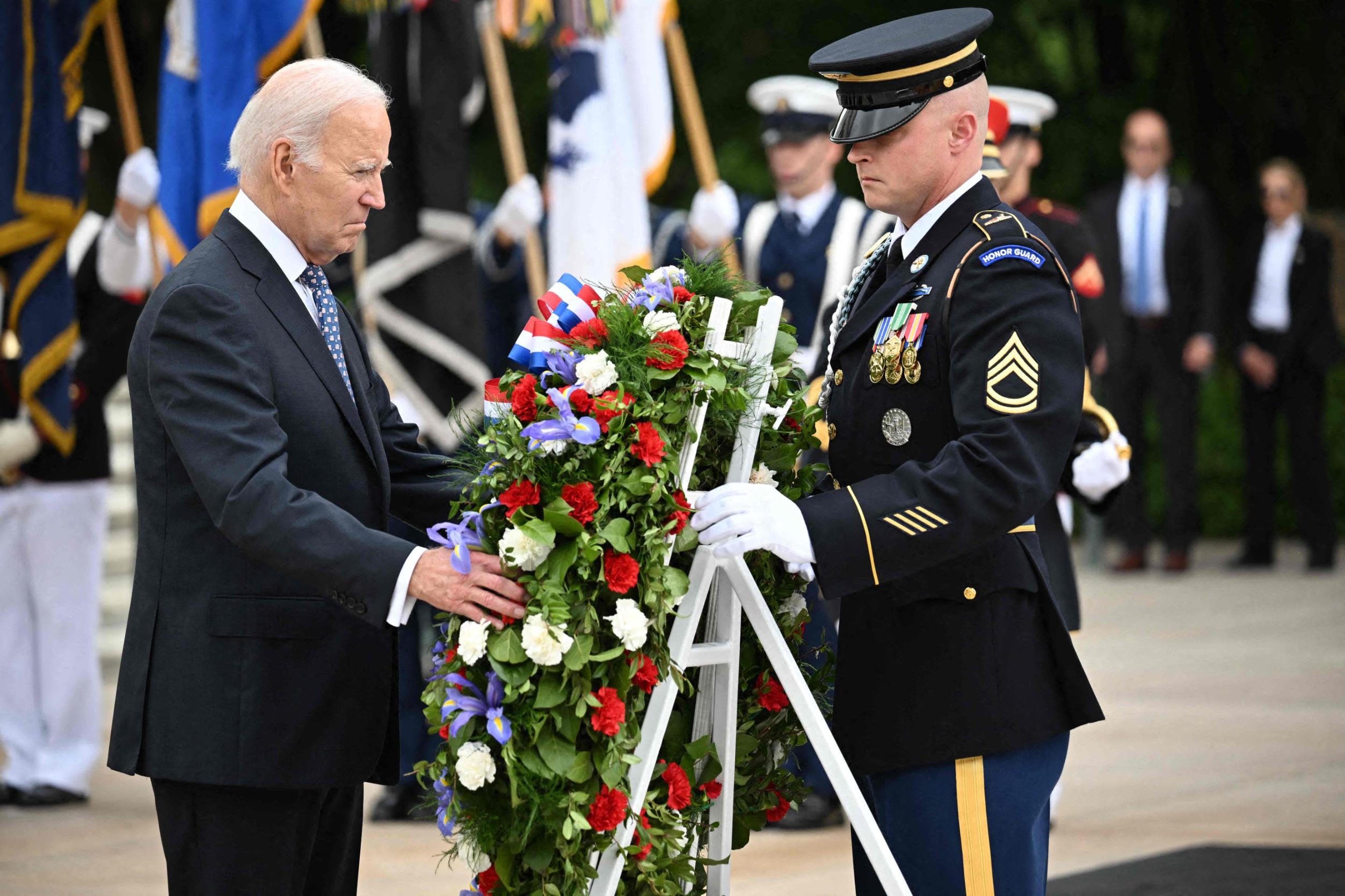 President Joe Biden participates in a wreath-laying ceremony Monday at the Tomb of the Unknown Soldier at Arlington National Cemetery.