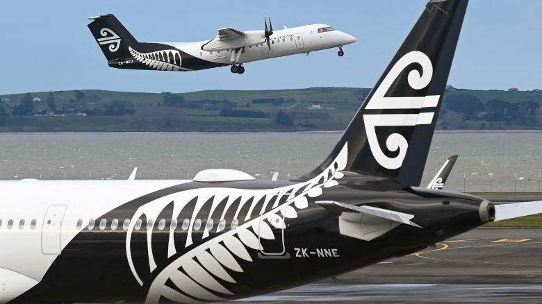 A photo taken on August 9, 2021 shows an Air New Zealand plane taking off from Auckland Airport with the national carrier managing to cut its losses by a third in the last financial year as strong domestic and cargo demand partially offset the impact of the global pandemic, the airline said August 26, 2021. (Photo by William WEST / AFP) (Photo by WILLIAM WEST/AFP via Getty Images)