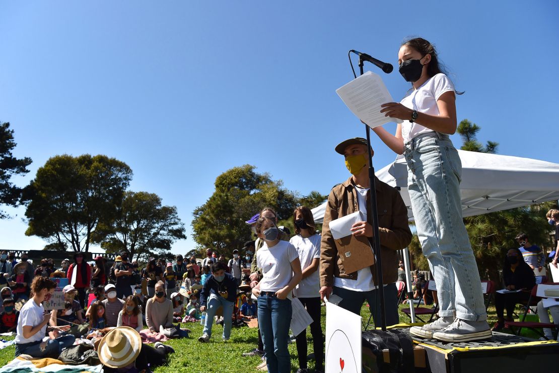 Event organizer Mina Fedor, then 12, speaks to attendees during a rally in solidarity with Asian Americans and Pacific Islanders held in Berkeley, California, on Sunday, March 28, 2021.