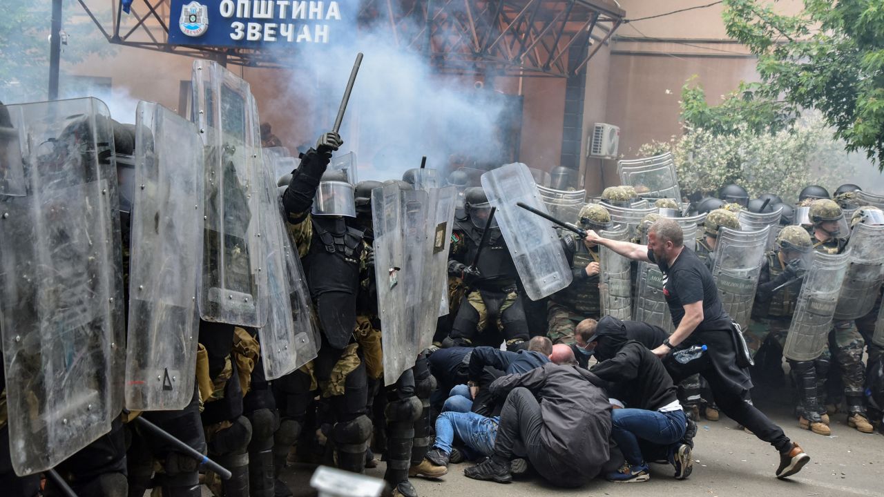 NATO's peacekeeping Kosovo Force (KFOR) clash with local protesters at the entrance of the municipality office, in the town of Zvecan, Kosovo, on May 29.