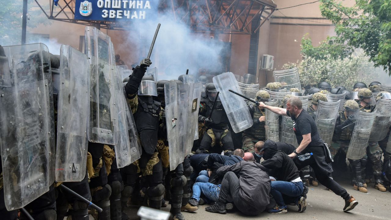 NATO Kosovo Force (KFOR) soldiers clash with local Kosovo Serb protesters at the entrance of the municipality office, in the town of Zvecan, Kosovo, May 29, 2023. REUTERS/Laura Hasani