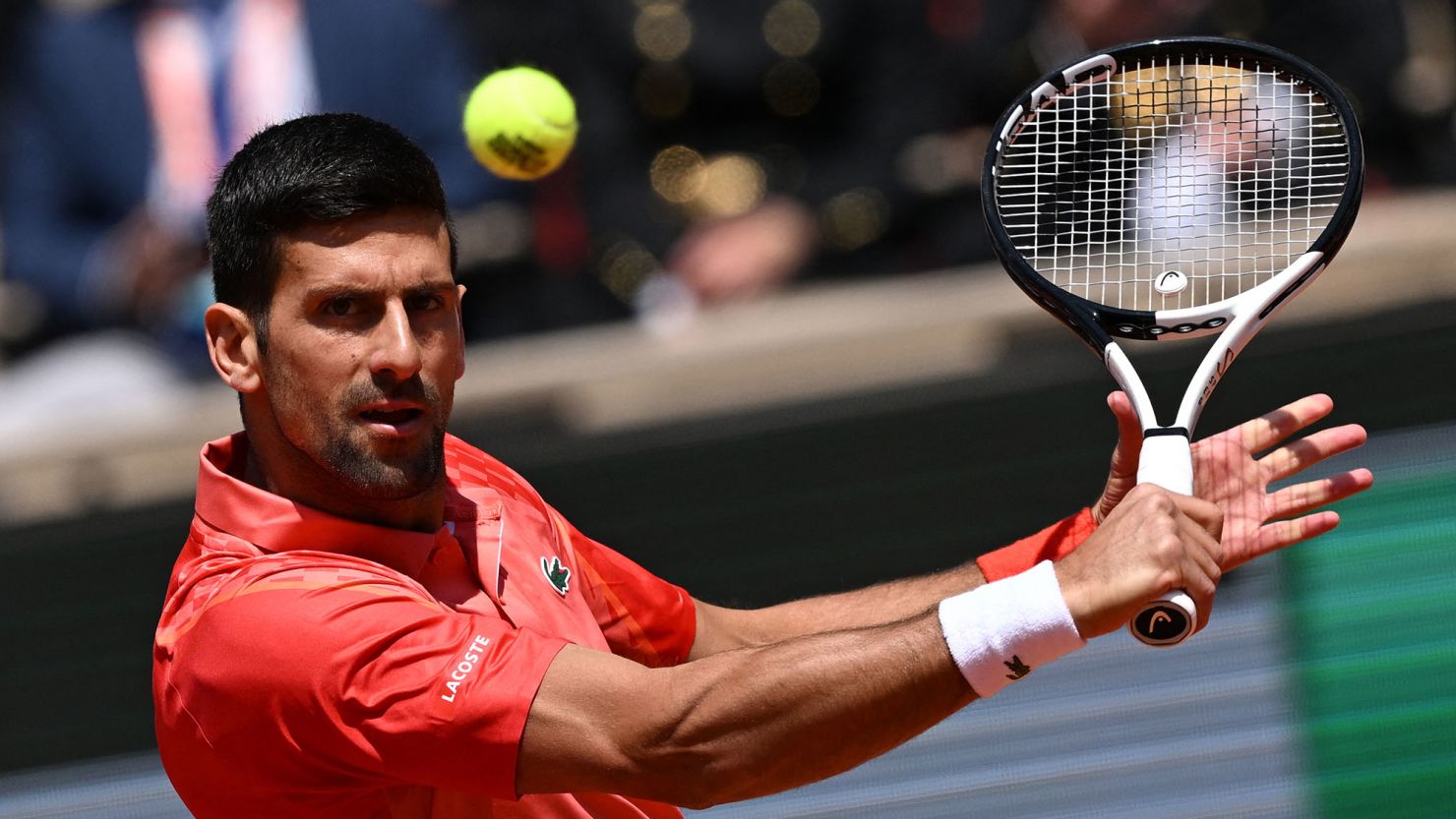 Djokovic plays a backhand against Aleksandar Kovacevic at the French Open. 