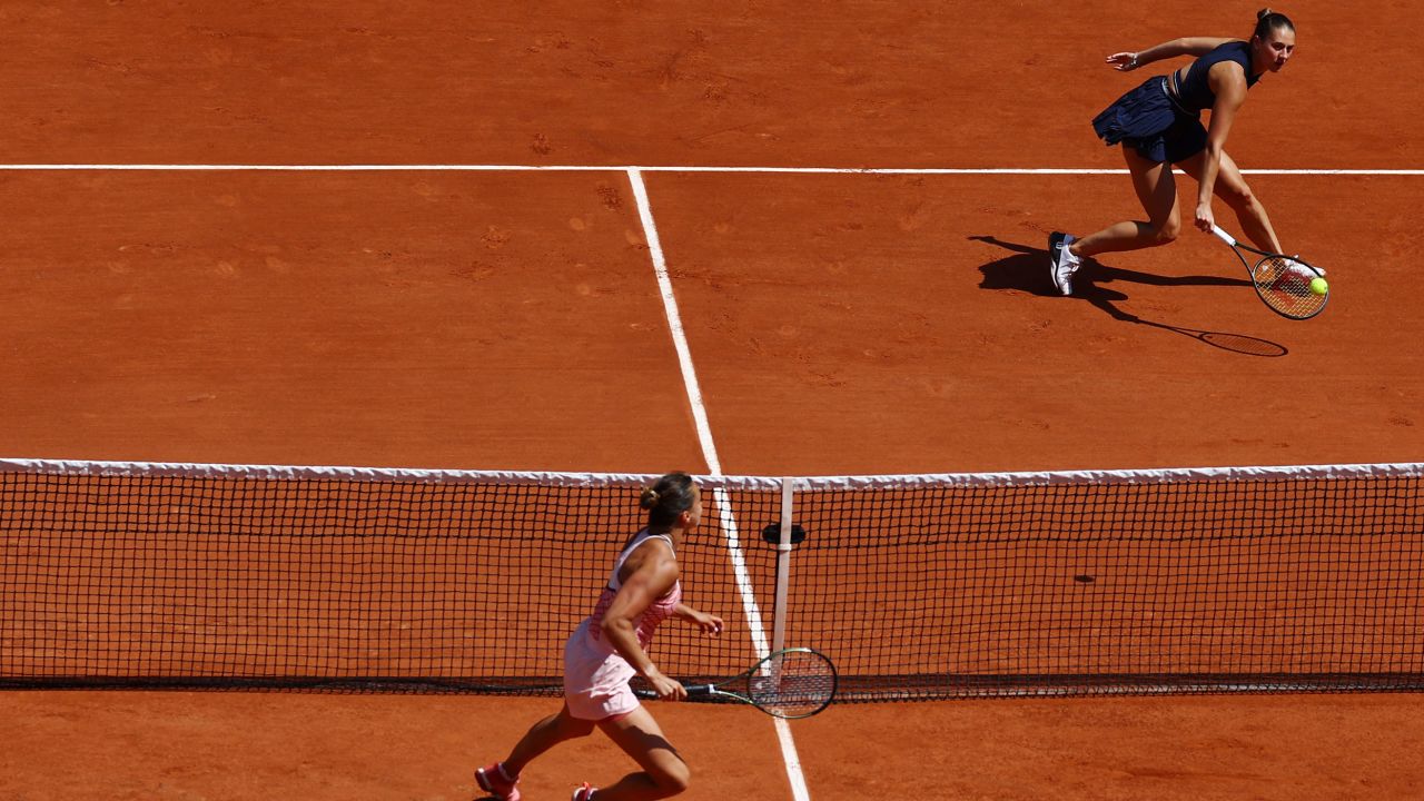 Kostyuk (right) and Sabalenka square off at the French Open. 