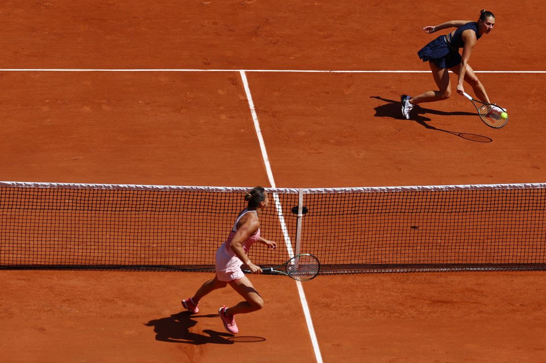 Kostyuk (right) and Sabalenka face off at the French Open. 