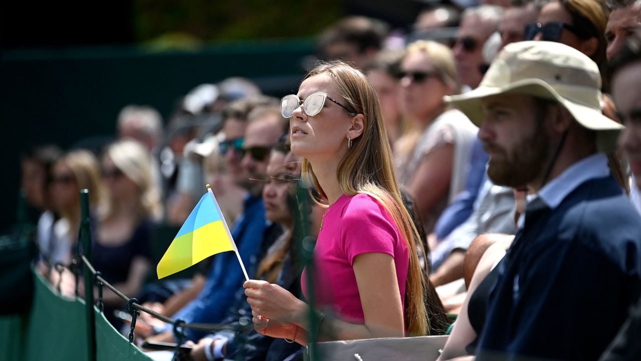 A spectator holds a Ukrainian flag at last year's Wimbledon. 