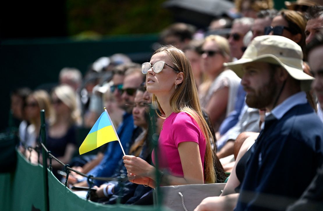 A spectator holds a Ukrainian flag at last year's Wimbledon. 