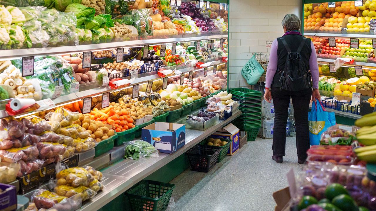 A shopper browses fruit and vegetables at an indoor market in Sheffield, UK, on Friday, May 19, 2023.